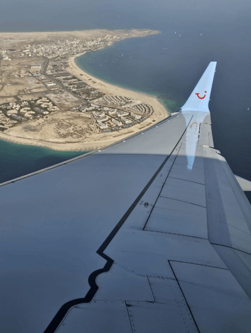 A holiday coastline seen from an aeroplane window